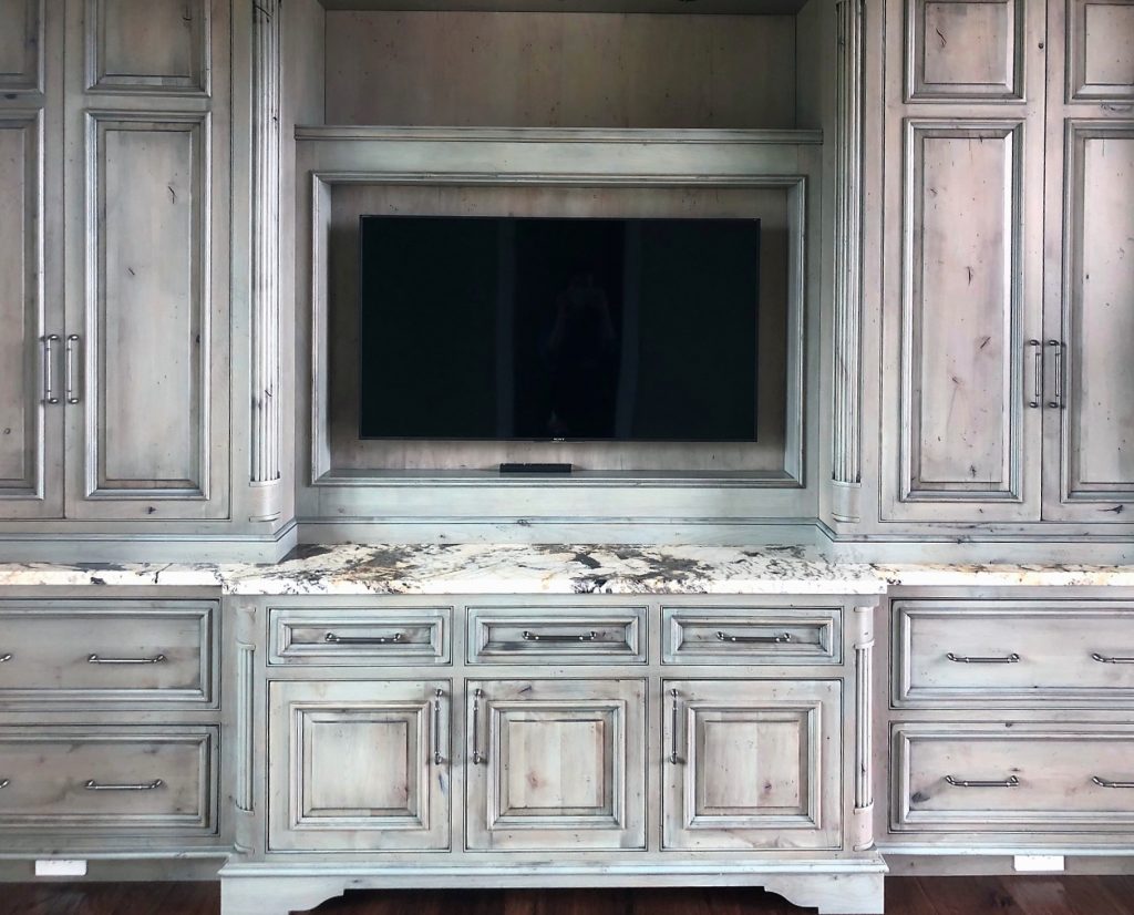 European Estate Study Cabinets woodwork in a weathered driftwood stain on knotty alder
